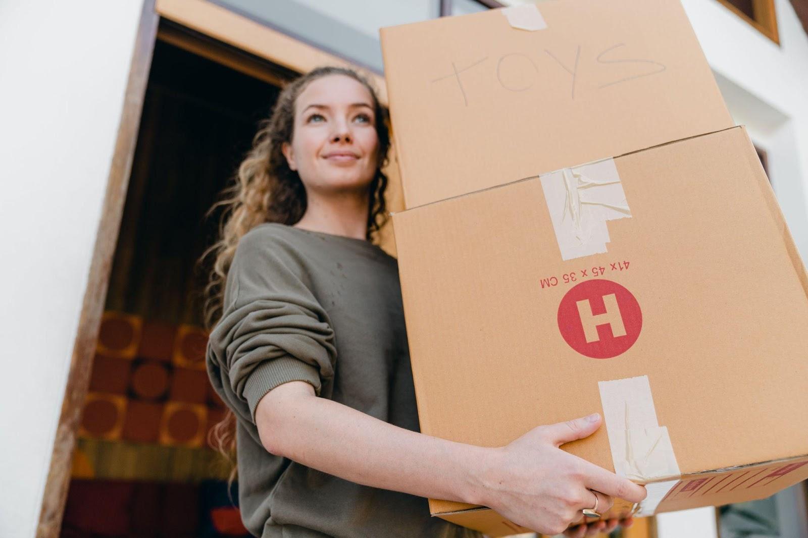 Girl carrying box